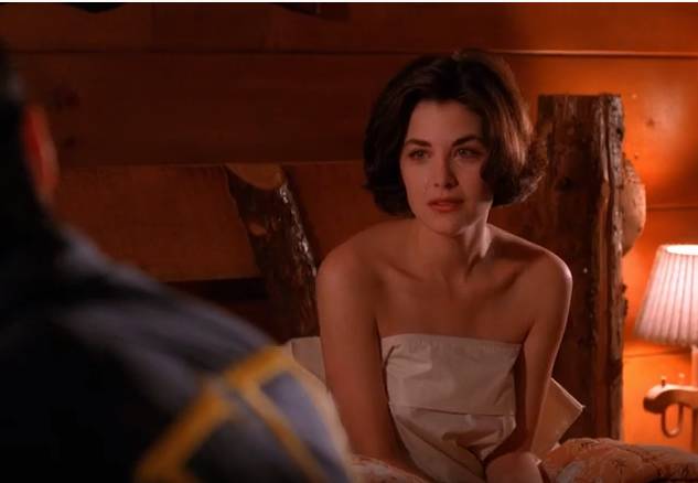 Audrey Horne sits up naked in a sheet