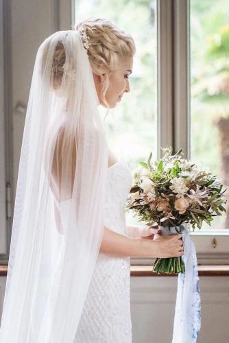 wedding bun hairstyles volume blonde updo with veil floral_style